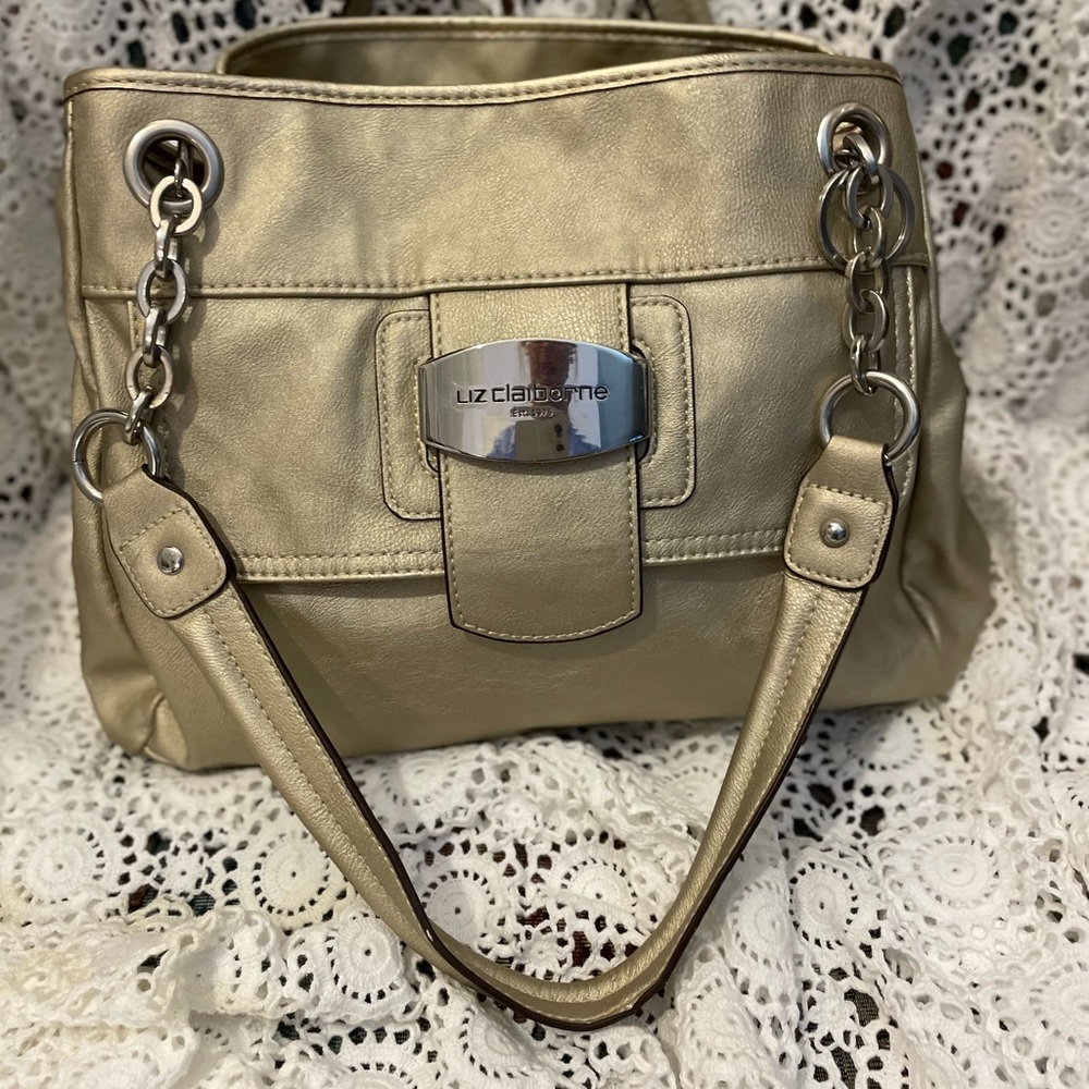 Liz Claiborne champagne, colored satchel with chains as handles. 10”L 15…